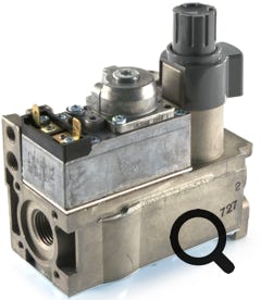 Photo of pilot lighting grey button on gas control valve.