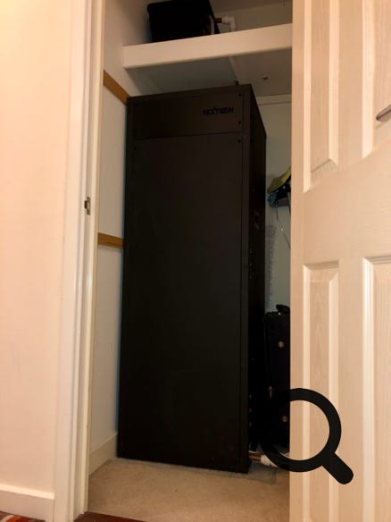 NextGen Thermacoil thermal store hot water tank installed in airing cupboard of modern apartment in Reading, Berkshire