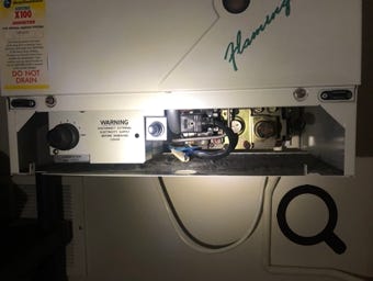 Potterton Flamingo temperature controls showing temperature control knob, gas valve and igniter button.